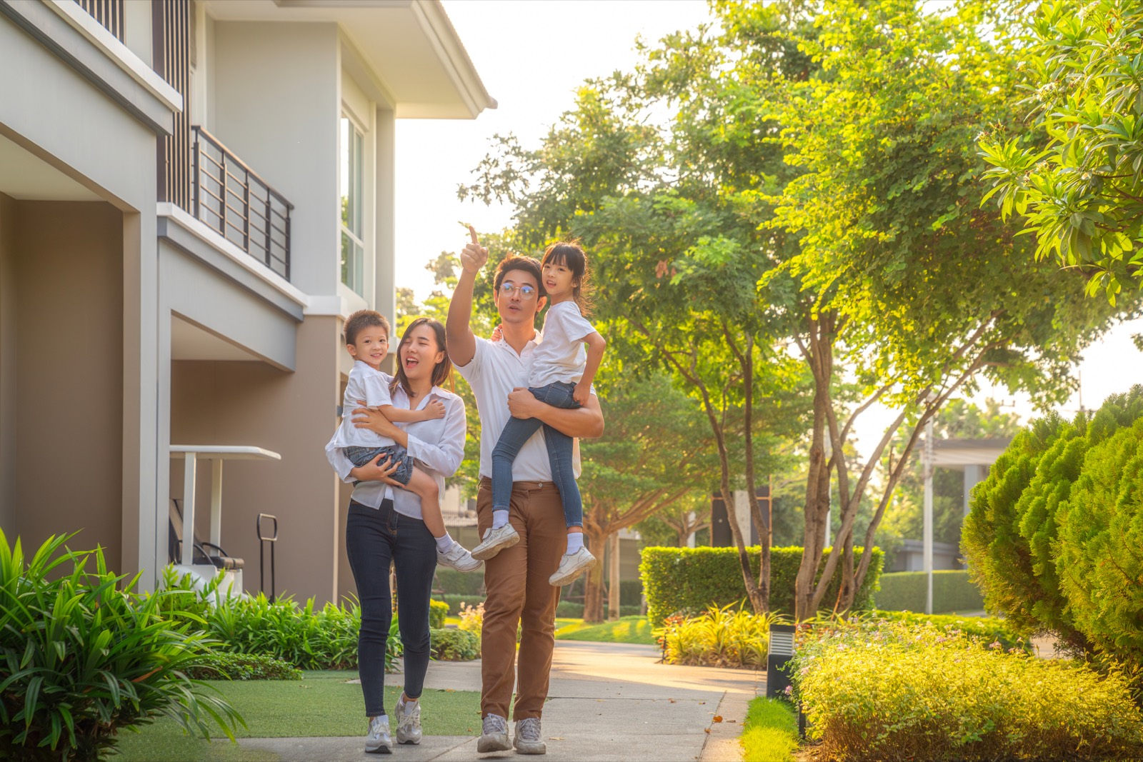 A family walking up to their new home