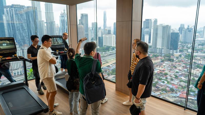 Clients studying a scale model of a development at a Crestbrick showroom