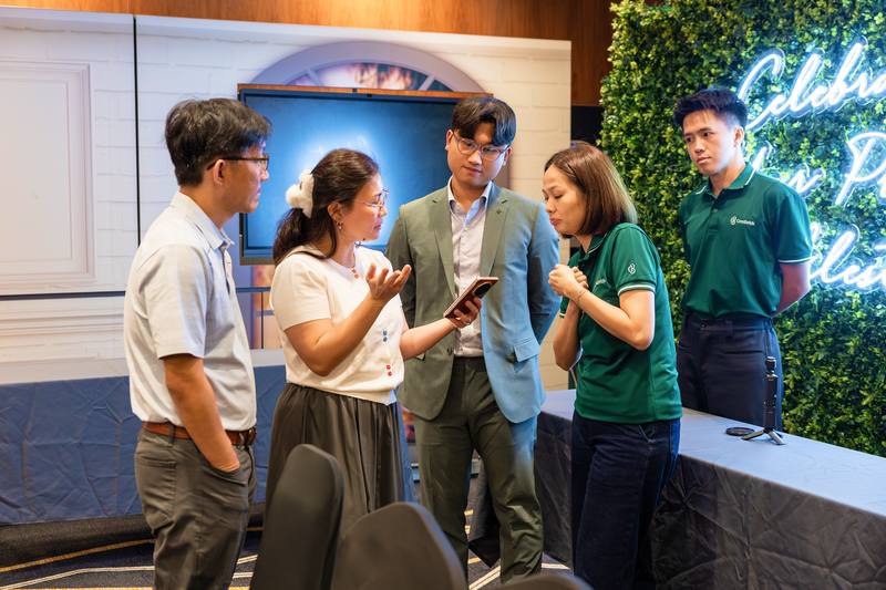 A Crestbrick associate talking a client through options on a tablet