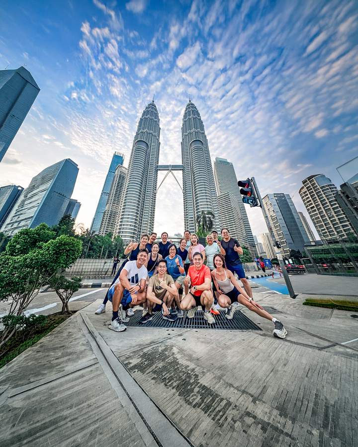 A Crestbrick client group at KLCC with the Petronas Twin Towers behind them