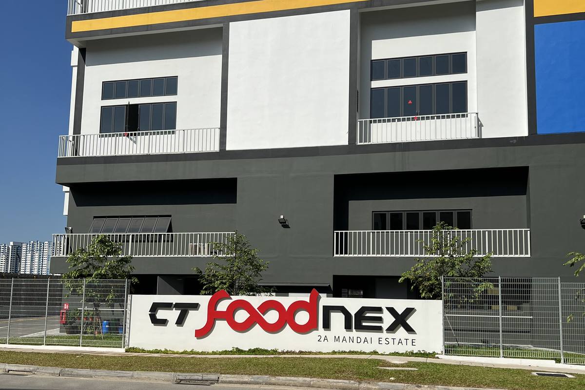 A multi-storey industrial building at CT FoodNex, Mandai Estate, with its signage on the frontage