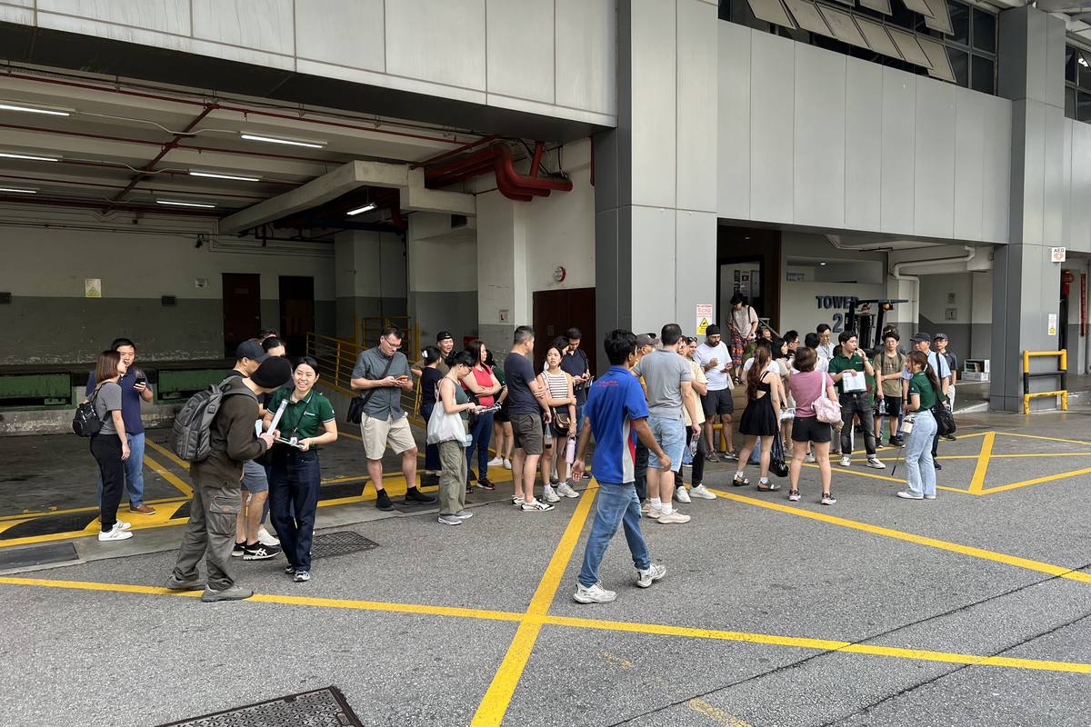 Prospective buyers and tenants gathered at the loading bays of an industrial development