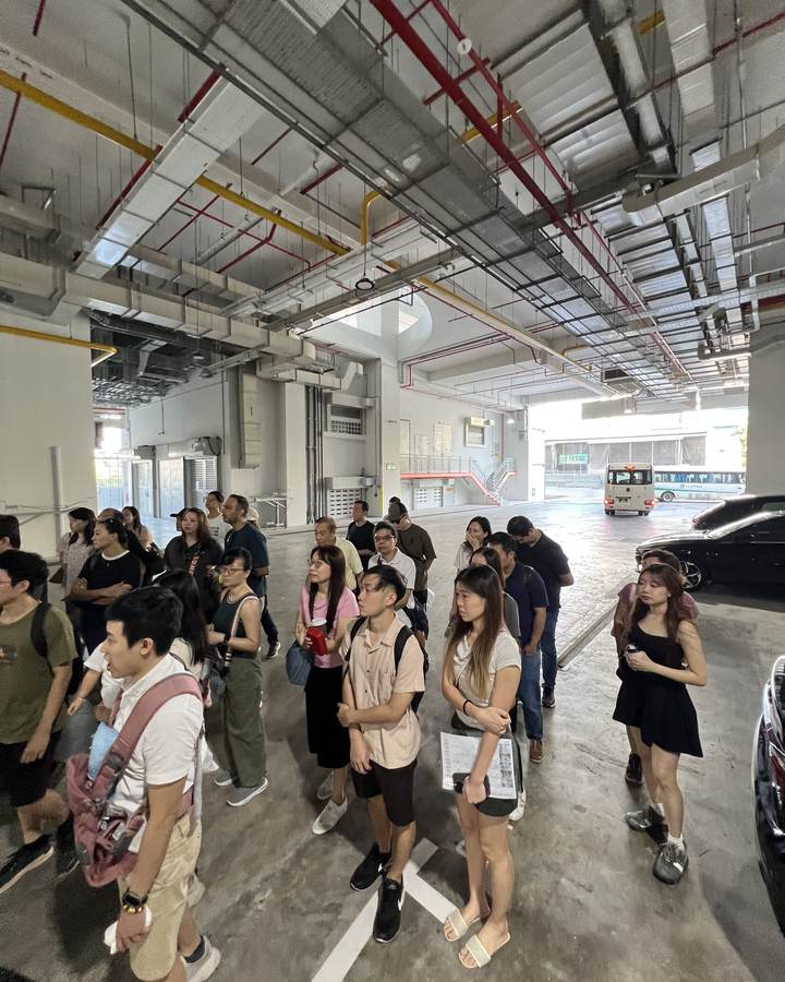 Crestbrick clients gathered in the loading area of a ramp-up industrial building
