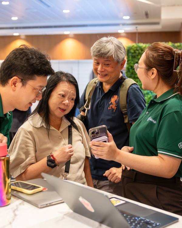 A Crestbrick associate going through figures with clients at an event